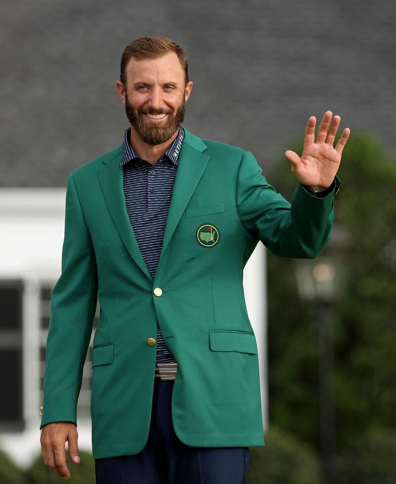 Dustin Johnson of the United States waves during the Green Jacket Ceremony after winning the Masters. AFP