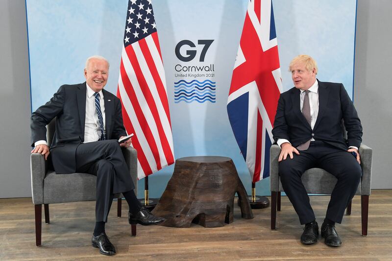 Britain's Prime Minister Boris Johnson speaks with Mr Biden during a meeting ahead of the G7 summit. Getty Images