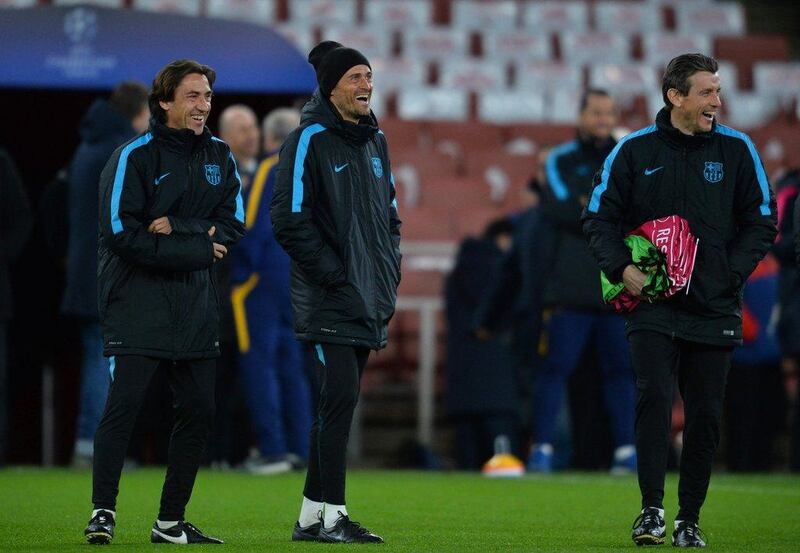 Barcelona's Coach Luis Enrique (C) attends a training session ahead of the UEFA Champions League round of 16 1st leg football match against Arsenal, at the Emirates Stadium in London on February 22, 2016.  Barcelona will play Arsenal at the Emirates Stadium in London on Tuesday February 23, 2016. / AFP / GLYN KIRK