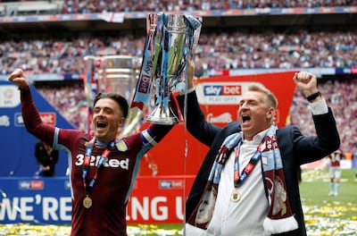 Soccer Football - Championship Playoff Final - Aston Villa v Derby County - Wembley Stadium, London, Britain - May 27, 2019  Aston Villa's Jack Grealish and manager Dean Smith celebrate with the trophy after winning the playoffs  Action Images via Reuters/Ed Sykes