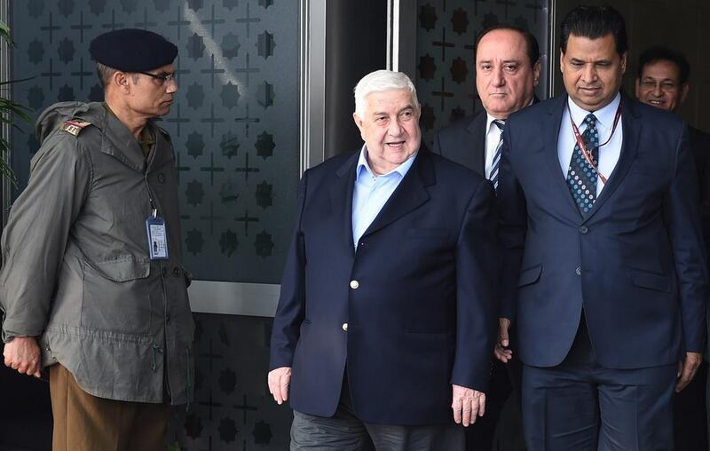 Syrian deputy prime minister and foreign minister, Walid Al Moualem, centre, arriving at the Indira Gandhi International Airport in New Delhi on January 11, 2016. Mr Moualem is on an official visit to India and will meet prime minister Narendra Modi.  Money Sharma / AFP Photo 