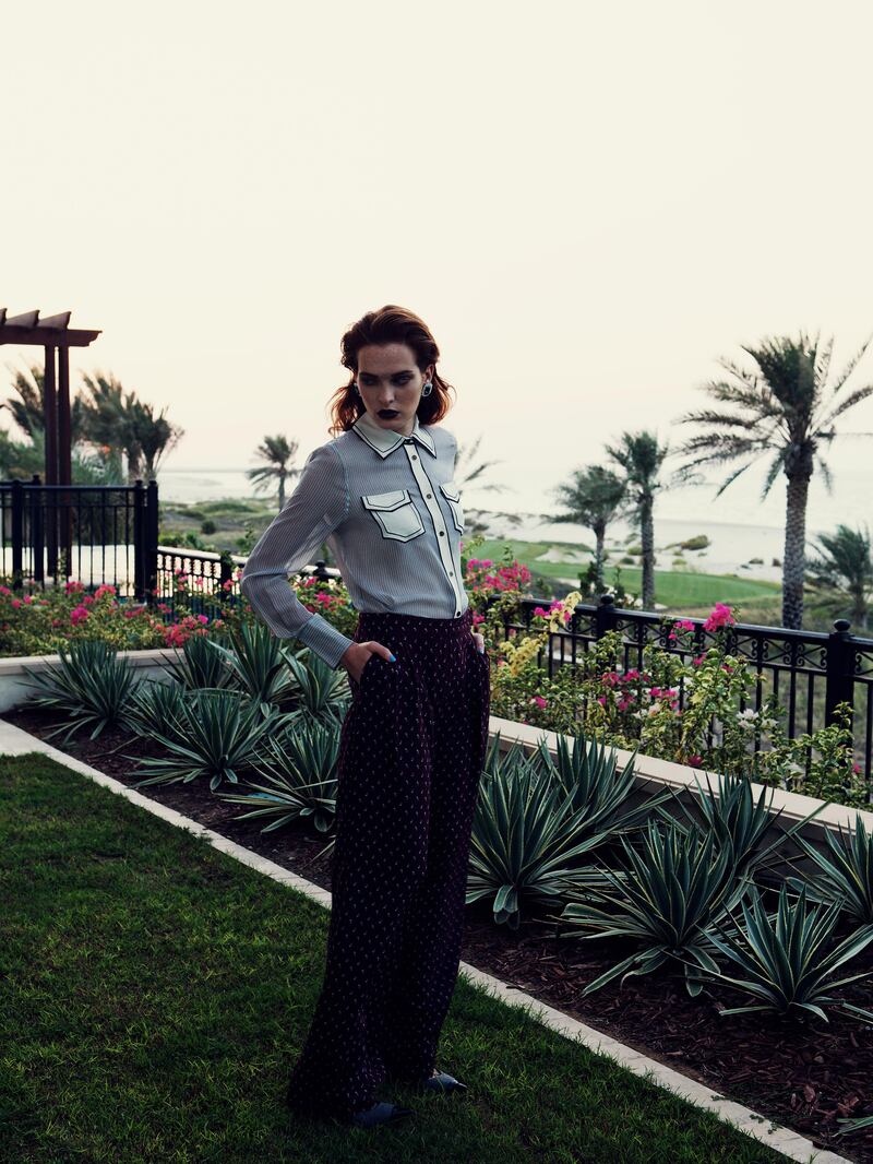 INTO THE SHADE: Shirt, Tory Burch. Trousers, Tibi at Boutique 1. Shoes, Jimmy Choo. Earrings, Kenneth Jay Lane at Bloomingdale's. (Photograph: Tina Chang; Fashion director: Katie Trotter; Styling: Nadia El Dasher)
