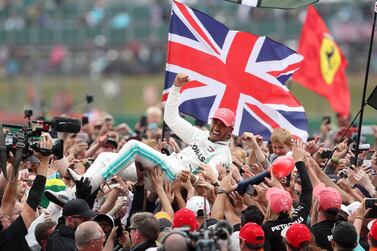 Mercedes driver Lewis Hamilton celebrates winning the British Grand Prix at Silverstone in 2019.  This year’s race will take place without fans. PA