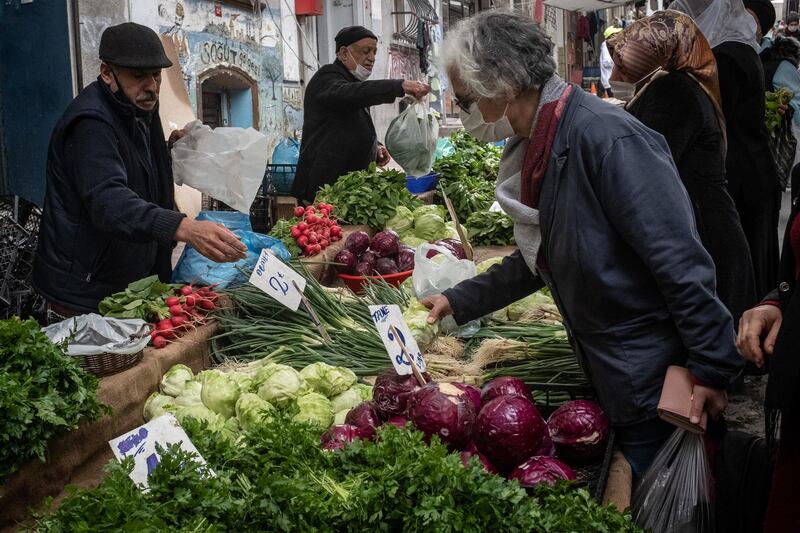 People shop at a local street market  in Istanbul, Turkey. Getty Images
