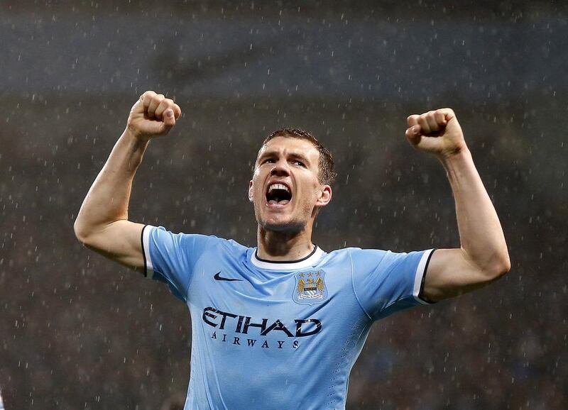 Edin Dzeko of Manchester City celebrates after scoring his side's first goal against Aston Villa on Wednesday. Phil Noble / Reuters / May 7, 2014