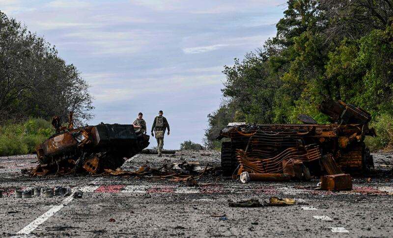 Charred armoured cars litter the road in Balakliia.  AFP