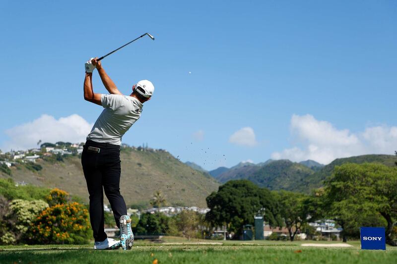 Collin Morikawa plays his shot from the seventh tee during the second round of the Sony Open in Hawaii. AFP