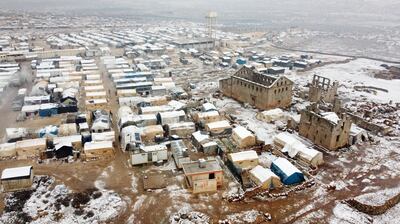 A sprinkling of snow at a camp for internally displaced Syrians, near the Turkish border in Idlib. AFP