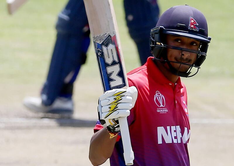 BULAWAYO, ZIMBABWE - MARCH 08: Paras Khadka of Nepal reacts after reaching his 50 during the ICC Cricket World Cup Qualifier between Scotland v Nepal at Queens Sports Club on March 8, 2018 in Bulawayo, Zimbabwe. (Photo by Nigel Roddis - ICC/ICC via Getty Images)