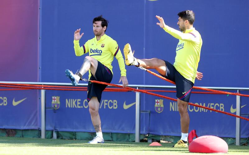 Lionel Messi and Luis Suarez during a training session at Ciutat Esportiva Joan Gamper. Getty Images
