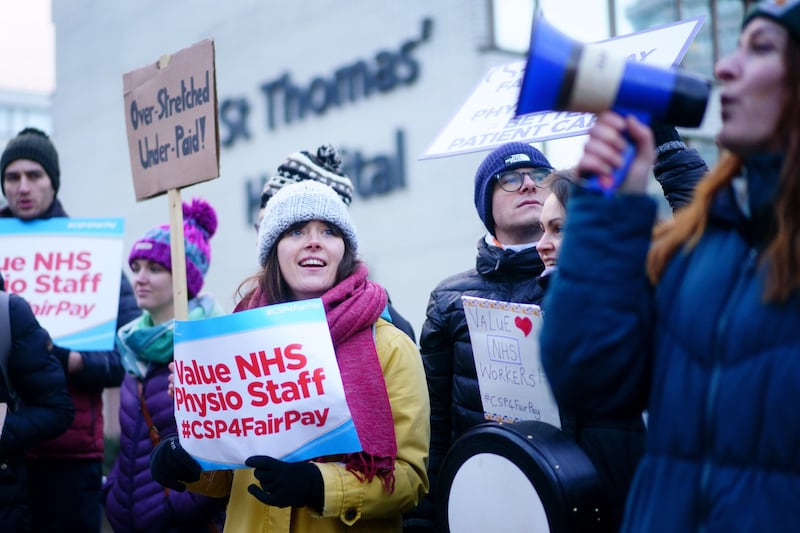 Members of the Chartered Society of Physiotherapy on the picket line outside London's St Thomas' Hospital as they strike for the first time. PA