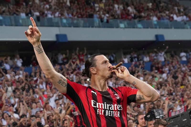 Zlatan Ibrahimovic puffs a cigar as he celebrates winning the Serie A title. AP