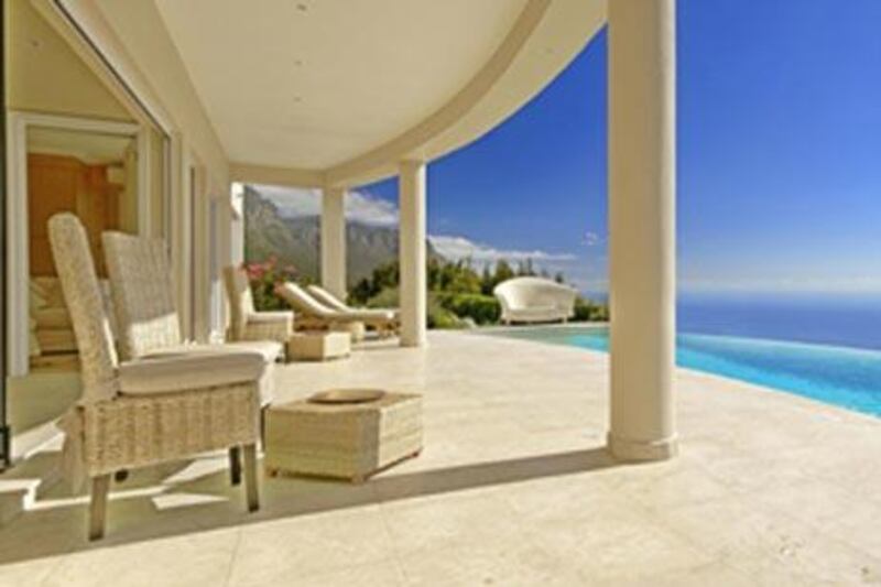 The hotel's patio overlooks the ocean.