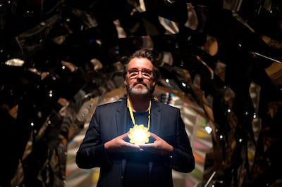 epa07705061 Danish-Icelandic artist Olafur Eliasson poses during a press preview at the Tate Modern in London, Britain, 09 July 2019. The exhibition 'Olafur Eliasson - In Real Life' runs at the Tate Modern from 11 July 2019 to 05 January 2020.  EPA/NEIL HALL