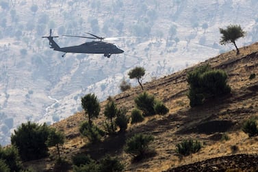 A Turkish army helicopter flies over mountains in the province of Sirnak, near the Turkish-Iraqi border, south-eastern Turkey. AFP file  