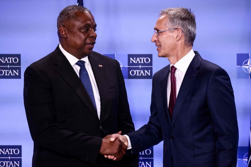 US Secretary of Defence Secretary Lloyd Austin, left, with Nato Secretary General Jens Stoltenberg at a meeting of the alliance's defence ministers at Nato headquarters in Brussels. AFP