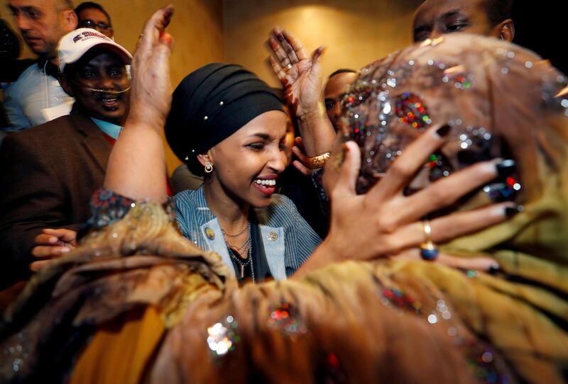 Omar is greeted by her husband’s mother after appearing at her midterm election night party. Reuters