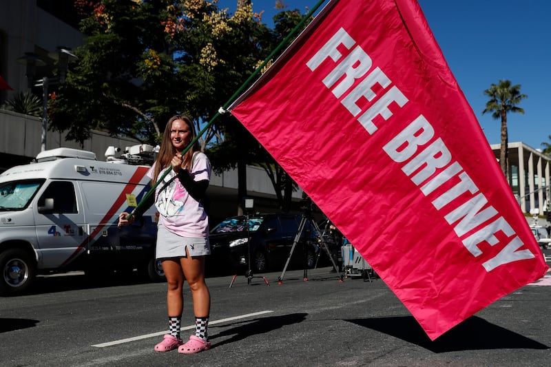 Alexandra Foertschbeck holds a 'Free Britney' flag during at the rally. EPA