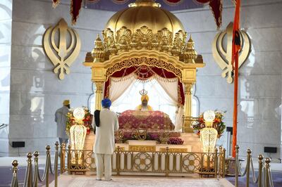 Dubai, United Arab Emirates - May 15, 2019: Members of the congregation pray. People take part in a multi faith Iftar at Gurunanak Darbar Sikh Gurudwara. Wednesday the 15th of May 2019. Jebel Ali, Dubai. Chris Whiteoak / The National