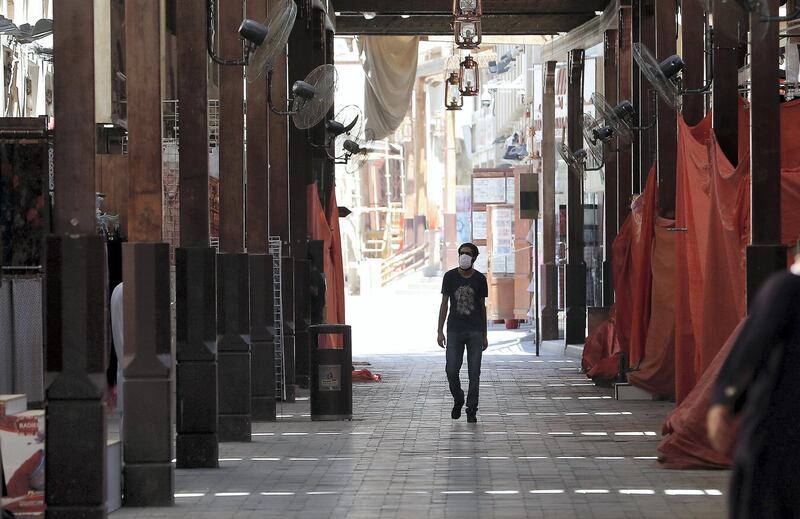 DUBAI, UNITED ARAB EMIRATES , May 6 – 2020 :- A person wearing protective face mask at the Grand souq which is closed as a preventive measure against coronavirus in Bur Dubai area in Dubai. (Pawan Singh / The National) For News/Standalone/Online/Stock/Instagram