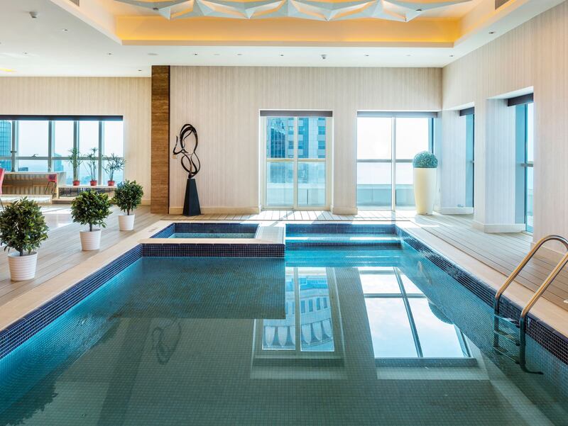 The private indoor pool spans a portion of the living room