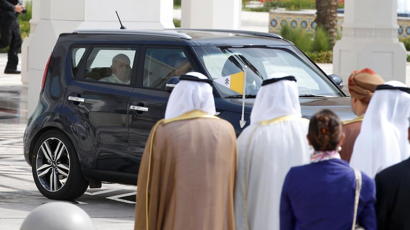 Pope Francis arrives to a welcome ceremony at the Presidential Palace in Abu Dhabi in a Kia Soul, accompanied by his personal secretary, Coptic priest Yoannis Lahzi Gaid. Photo: Reuters