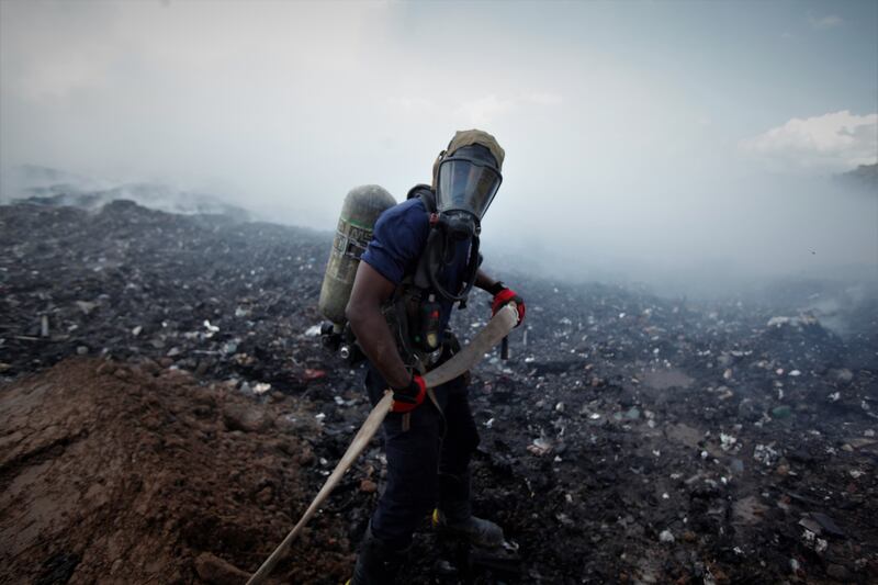 Firefighters attend a blaze in Cerro Patac, Panama. EPA