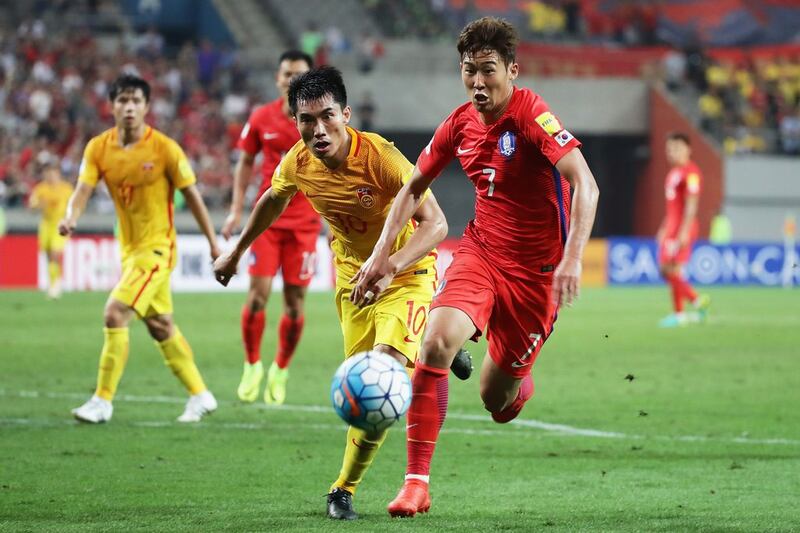 Son Heung-min of South Korea and Zheng Zhi of China compete for the ball during the 2018 World Cup Group A qualifier at Seoul World Cup Stadium on September 1, 2016 in Seoul, South Korea. Chung Sung-jun / Getty Images 