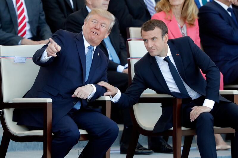 French President Emmanuel Macron and U.S. President Donald Trump attend the traditional Bastille Day military parade on the Champs-Elysees in Paris, France, July 14, 2017. REUTERS/Charles Platiau