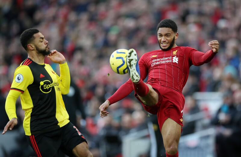 Liverpool's Joe Gomez in action with Watford's Andre Gray. Reuters
