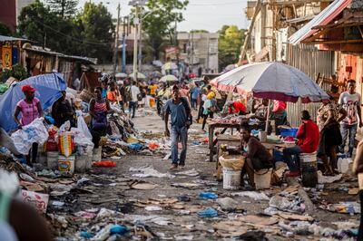 A man walks through a Petion-Ville street market in the Haitian capital of Port-au-Prince. Reuters