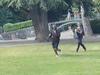 A screen grab taken from a video shows a man armed with a knife running away after a group of pre-school children was attacked in Annecy. AFPTV
