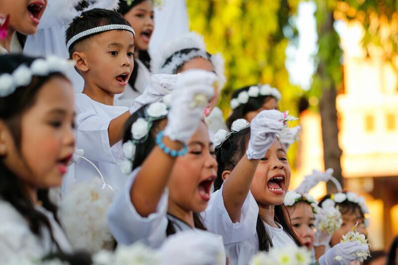 Children dressed as angels perform during the Easter Sunday celebration 'Salubong' in Santo Tomas, Pampanga, Philippines. EPA.