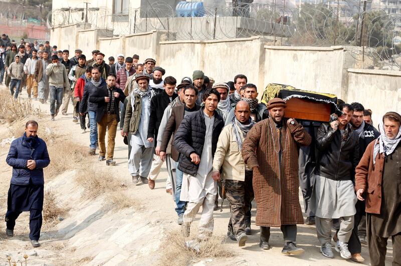Afghan men carry the coffin of one of the victims of yesterday's car bomb attack at in Kabul, Afghanistan January 28, 2018. REUTERS/Omar Sobhani