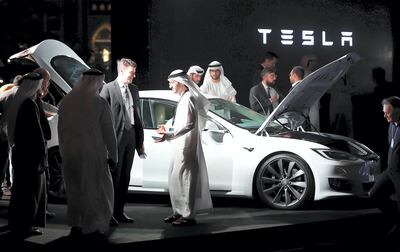 Emirati men check a vehicle manufactured by Electric carmaker Tesla during a ceremony in Dubai, on February 13, 2017.


Tesla announced the opening of a new Gulf headquarters in Dubai, aiming to conquer an oil-rich region better known for gas guzzlers than environmentally friendly motoring. / AFP PHOTO / KARIM SAHIB