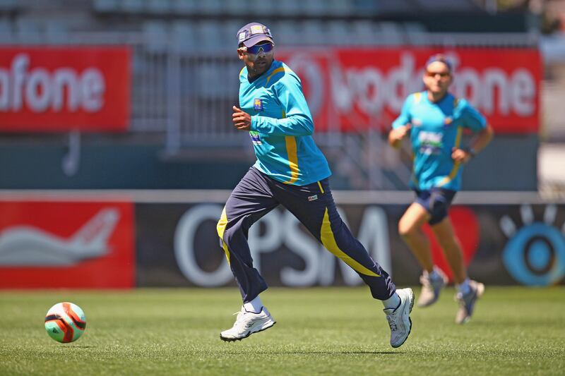 HOBART, AUSTRALIA - DECEMBER 12:  Mahela Jayawardene of Sri Lanka kicks a soccer ball during a Sri Lanka nets session at Blundstone Arena on December 12, 2012 in Hobart, Australia.  (Photo by Robert Cianflone/Getty Images)