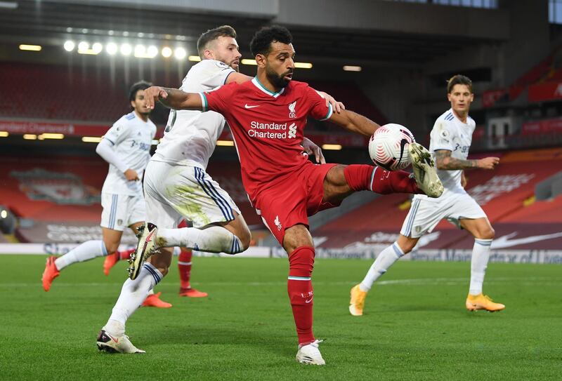Liverpool's Mohamed Salah under pressure from Stuart Dallas of Leeds. Reuters
