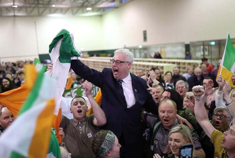 Thomas Gould of Sinn Fein tops the poll and is elected in Cork North Central, during the Irish General Election count at the Nemo Rangers GAA Club in Cork, Ireland. PA via AP