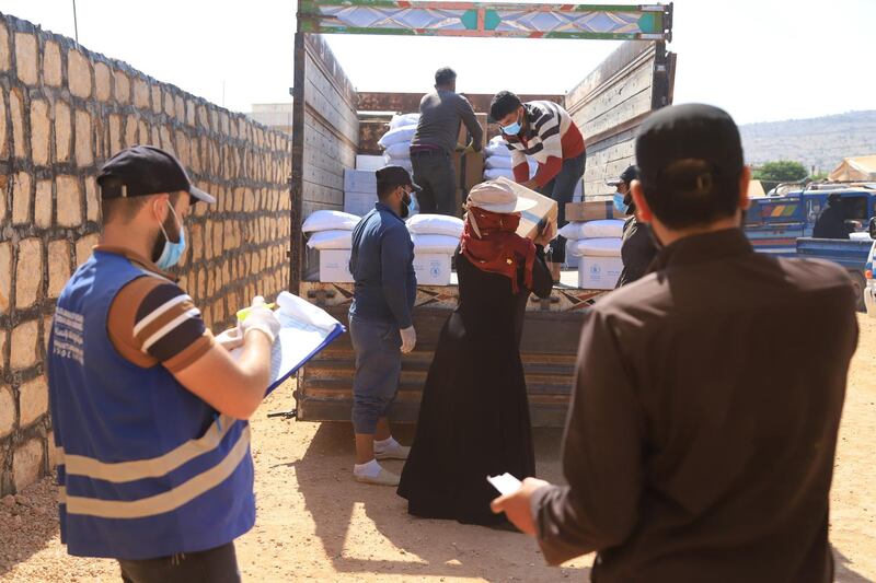 One of the beneficiary inhabitants in camps on the borders gets her food aid of WFP project.