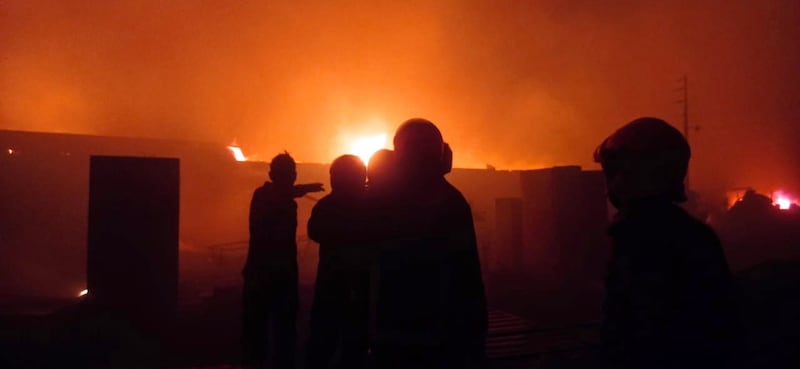 Flames engulf structures in a fire that has broken out in the Rohingya refugee camp in Cox's Bazar, Bangladesh. EPA