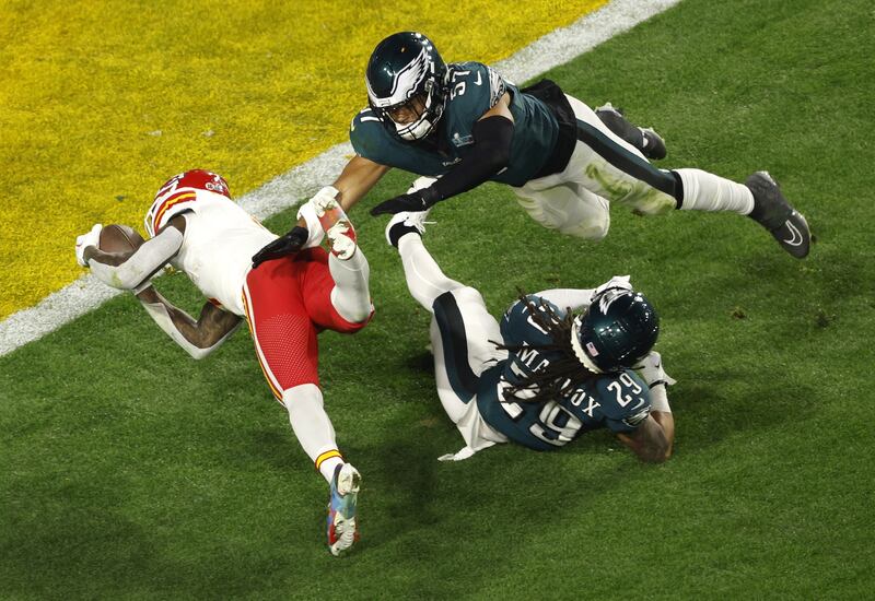Kansas City Chiefs running back Jerick McKinnon is tackled at the one by Philadelphia Eagles TJ Edwards and Avonte Maddox in the third quarter of Super Bowl LVII. EPA