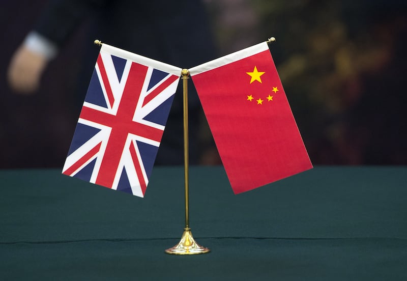 UK backbenchers are seeking a more hawkish stance in regards to Beijing. PA