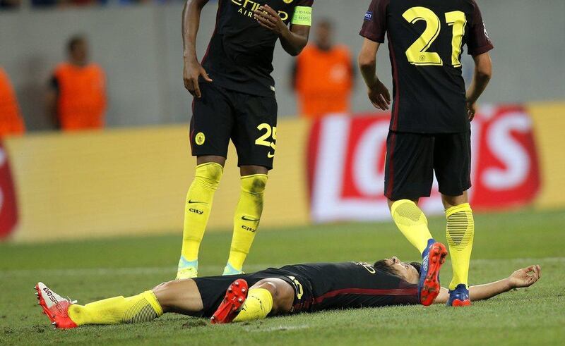 Sergio Aguero (down) reacts after scoring a hat trick. (EPA)