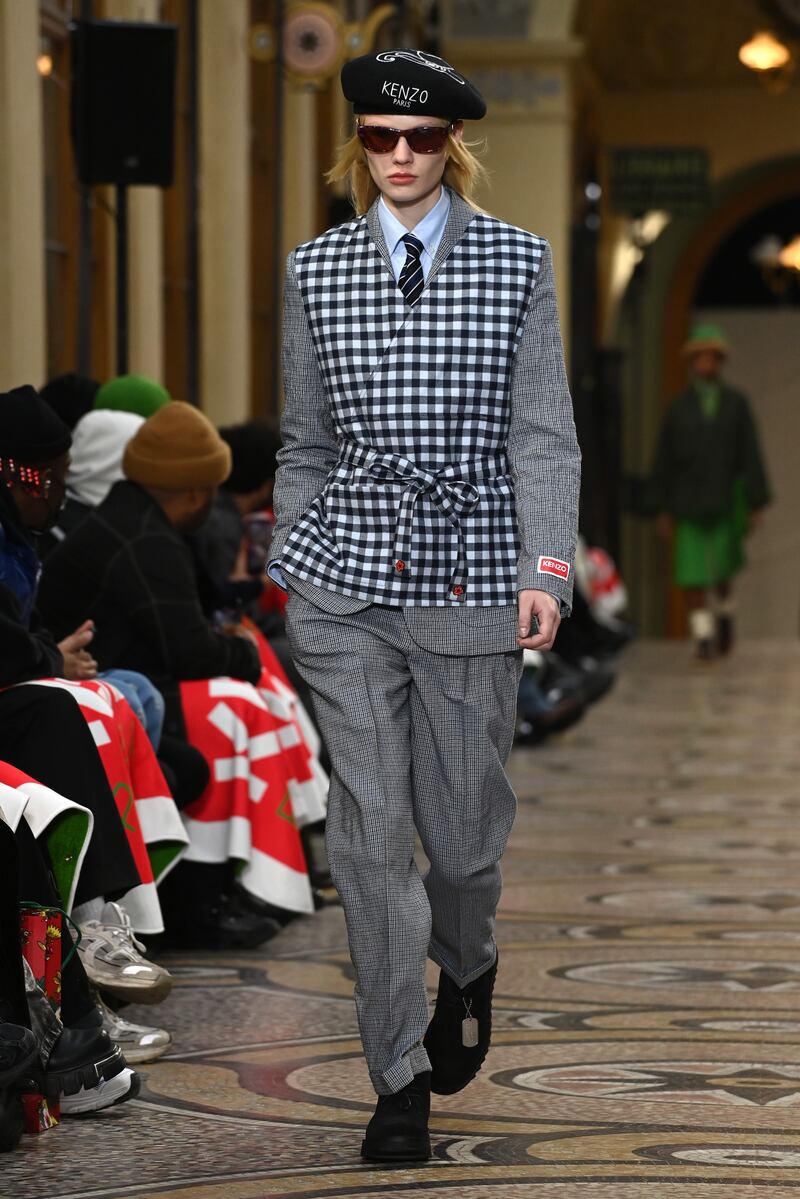 In a nod to Japanese culture, a suit is worn under a gingham apron.