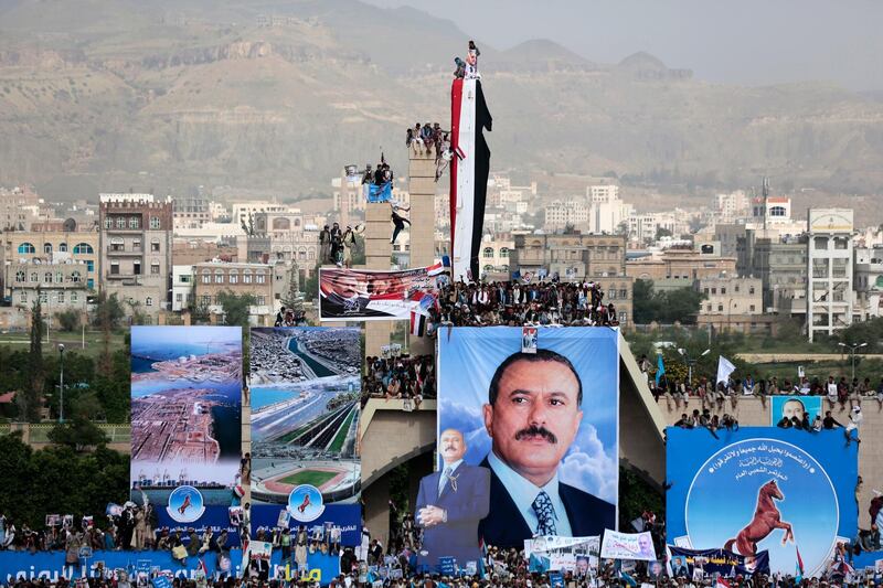 FILE - In this Aug. 24, 2017 file photo, supporters of former Yemeni President Ali Abdullah Saleh attend a ceremony marking the 35th anniversary of the founding of the Popular Conference Party, in Sanaa, Yemen. Yemeni officials said Wednesday, Oct. 3, 2018,  that the Houthi rebels have released two sons of the late former President Ali Abdullah Saleh. The officials, who spoke on condition of anonymity because they were not authorized to brief media, said Omani officials and the U.N. envoy to Yemen, Martin Griffiths, helped negotiate the release of Salah and Madian Saleh. (AP Photo/Hani Mohammed, File)