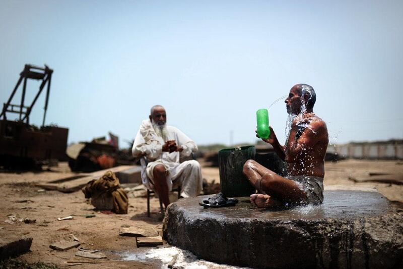 Cleaning up: a worker makes himself clean before the dinner which follows his long shift.