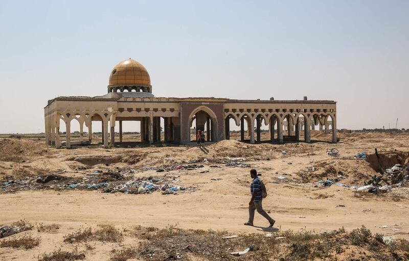 A man walks in front of the destroyed and deserted terminal of the Gaza Strip's former Yasser Arafat International Airport, in Rafah. AFP