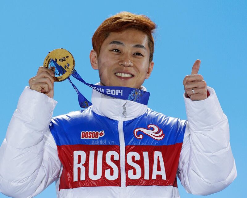 FILE - In this Feb. 15, 2014, file photo, men's 1,000-meter short track speedskating gold medalist Viktor Ahn, of Russia, gestures while holding his medal during the medals ceremony at the Winter Olympics in Sochi, Russia. Six-time Olympic gold medalist Ahn and three former NHL players are among 32 Russian athletes who filed appeals Tuesday, Feb. 6, 2018, seeking spots at the Pyeongchang Olympics.(AP Photo/David J. Phillip, File)