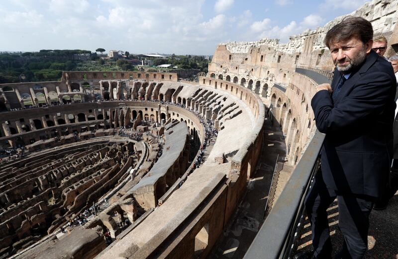 Culture minister Dario Franceschini looks out from the topmost level of the Colosseum. Andrew Medichini / AP Photo