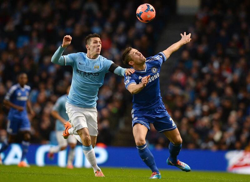 Jovetic vies with Chelsea's English defender Gary Cahill during the match on Saturday. Andrew Yates / AFP